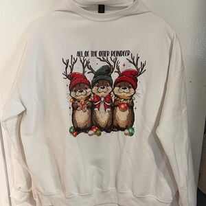 His and Hers Holiday Sweaters with Festive Otter Design